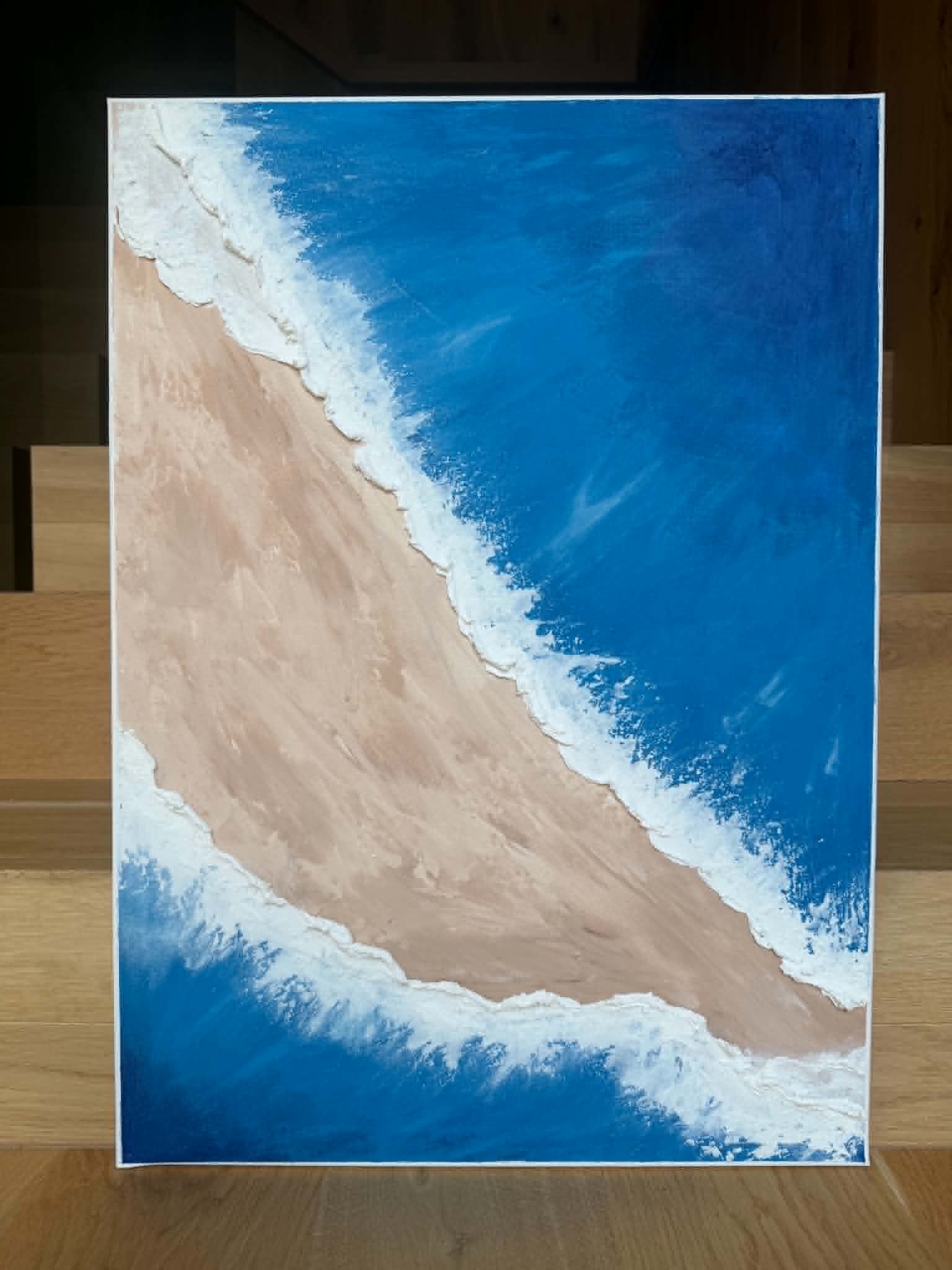 Struktuurne akrüülmaal lõuendpapil "Sandy Beach". Kujutatud sinist vett, pruuni liivaranda ja ühte valget vahust veeriba - the flos edit.